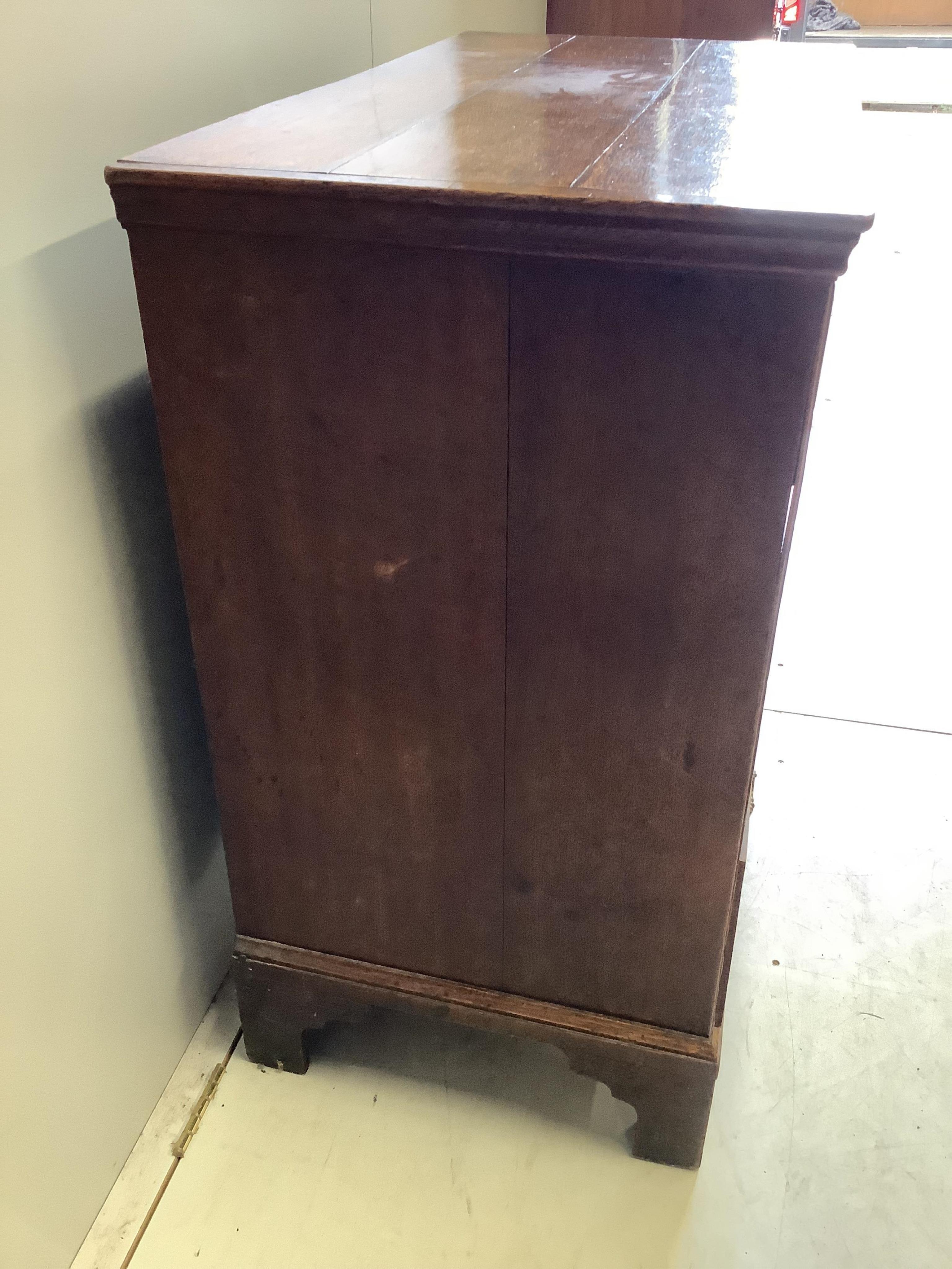 A mid 18th century oak chest, fitted with two short and three long drawers, width 93cm, depth 50cm, height 94cm. Condition - fair